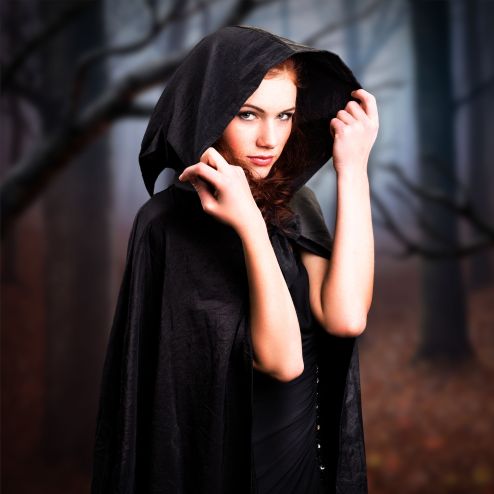 33281779 - young witch in a forest